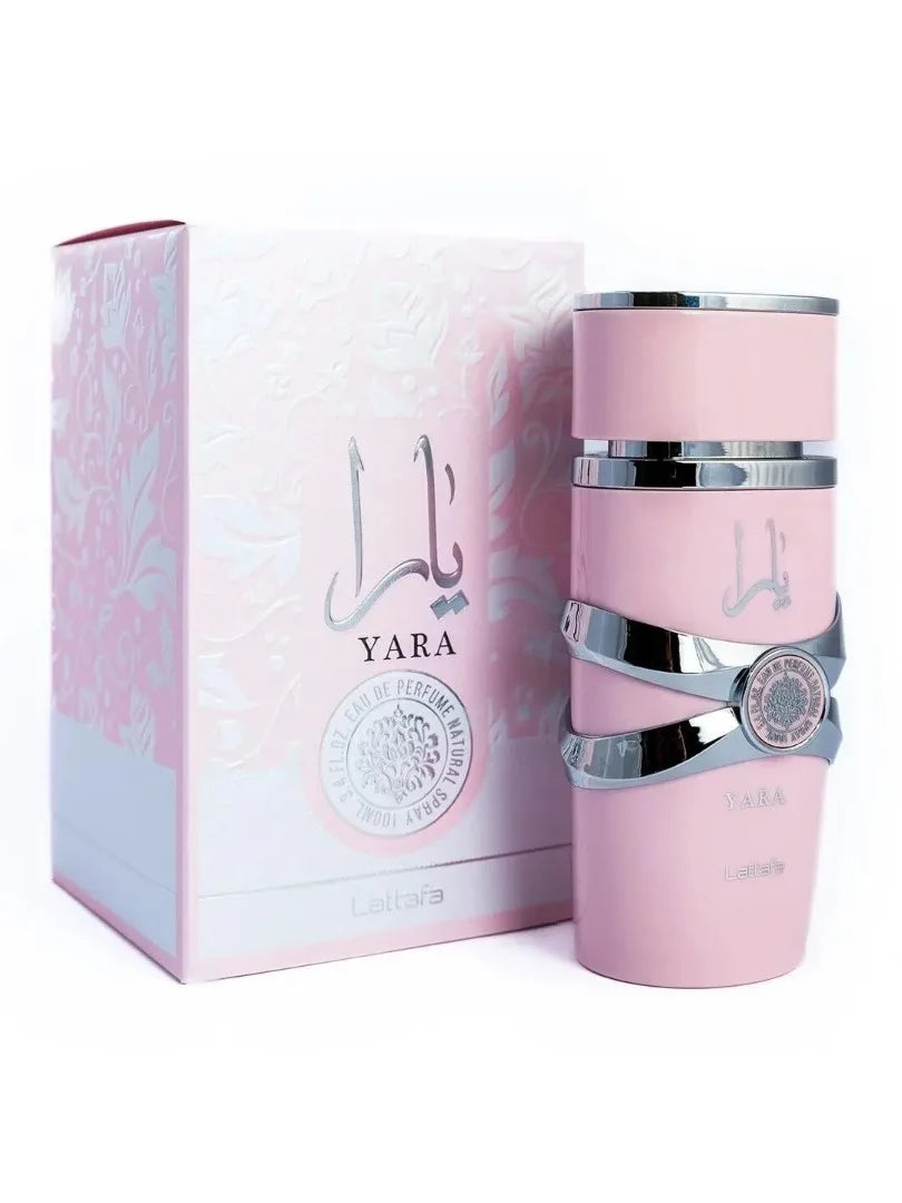 Pink perfume bottle with silver accents and packaging on a white background